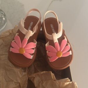 Mini Melissa size 7 toddler sandal. Never worn. New with box.